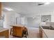 Open concept kitchen with tile floors, kitchen island with seating, and stainless steel sink at 825 Karie Dr, Mcdonough, GA 30253