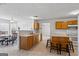 Kitchen featuring a breakfast nook with access to stainless steel sinks, and white appliances at 825 Karie Dr, Mcdonough, GA 30253