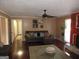 Inviting living room featuring hardwood floors, a ceiling fan, and comfortable seating with stylish decor and natural light at 5848 Navarre Ct, Stone Mountain, GA 30087