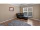 Inviting living room space with hardwood floors, natural light, and comfortable seating at 70 Caseys Way, Covington, GA 30014