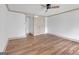 Bright bedroom showcasing hardwood floors, large window, closet, and neutral color palette at 6274 Booker Ln, Lithonia, GA 30058