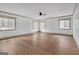 Large bedroom boasting beautiful hardwood floors, ample natural light from many windows, and crown molding at 6274 Booker Ln, Lithonia, GA 30058