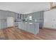 Well-lit kitchen featuring gray cabinets, granite countertops, and a stylish backsplash at 6274 Booker Ln, Lithonia, GA 30058