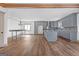 Open concept kitchen with gray cabinets, granite countertops, and modern appliances at 6274 Booker Ln, Lithonia, GA 30058