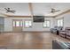 Open-concept living room with hardwood floors, recessed lighting, and a modern ceiling fan at 6274 Booker Ln, Lithonia, GA 30058