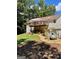 Backyard featuring a deck with a gazebo, green space, and a convenient filtration system at 200 Timber Ridge Dr, Mcdonough, GA 30252