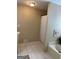 Bright bathroom featuring a shower with a white curtain and a soaking tub at 200 Timber Ridge Dr, Mcdonough, GA 30252