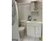 Compact bathroom with white tiled floor and vanity at 200 Timber Ridge Dr, Mcdonough, GA 30252