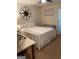 Cozy bedroom with comfortable bed, natural light, and a decorative compass on the wall at 200 Timber Ridge Dr, Mcdonough, GA 30252