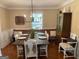 Inviting dining room featuring a large table and traditional decor at 200 Timber Ridge Dr, Mcdonough, GA 30252