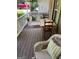 Cozy front porch furnished with wicker furniture and a swing, perfect for relaxing outdoors at 200 Timber Ridge Dr, Mcdonough, GA 30252