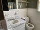 Functional bathroom featuring a single sink vanity and a standard toilet at 376 Lakewood Dr, Social Circle, GA 30025