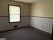Bedroom featuring a window, natural light, and floral design at 376 Lakewood Dr, Social Circle, GA 30025
