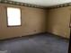 Neutral bedroom featuring a window, carpeted floor, and decorative border at 376 Lakewood Dr, Social Circle, GA 30025