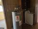 Laundry area featuring a hot water heater and washing machine at 376 Lakewood Dr, Social Circle, GA 30025