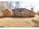 Brick house back exterior with a wooden deck at 195 Youngs Cir, Fayetteville, GA 30215