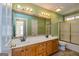 Bathroom features double sink vanity, large mirror and a shower-tub combo at 195 Youngs Cir, Fayetteville, GA 30215