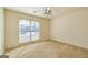 The secondary bedroom provides a ceiling fan and a large window at 195 Youngs Cir, Fayetteville, GA 30215