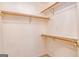 An empty closet is shown with shelves and wood supports at 195 Youngs Cir, Fayetteville, GA 30215