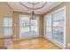 Sun-filled dining room with hardwood floors and decorative ceiling at 195 Youngs Cir, Fayetteville, GA 30215