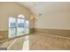 Spacious dining room with large window, elegant lighting, and neutral carpet at 195 Youngs Cir, Fayetteville, GA 30215
