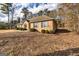 Cozy brick home with mature landscaping and shuttered windows at 195 Youngs Cir, Fayetteville, GA 30215