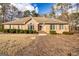 Charming brick home features a manicured lawn and inviting entrance at 195 Youngs Cir, Fayetteville, GA 30215