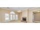 Living room with a traditional fireplace, ceiling fan, and access to the backyard at 195 Youngs Cir, Fayetteville, GA 30215