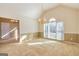Open living room with vaulted ceiling, neutral carpet, and a large window at 195 Youngs Cir, Fayetteville, GA 30215