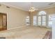 Spacious living room with plush carpet, ceiling fan, and lots of natural light at 195 Youngs Cir, Fayetteville, GA 30215