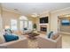 Comfortable living room with a brick fireplace, ample seating, and lots of natural light at 195 Youngs Cir, Fayetteville, GA 30215