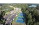An aerial view of tennis courts, a parking lot, a pool and a lake near a charming property at 130 Dockside Dr # 380, Fayetteville, GA 30215