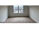 Finished attic space with carpet flooring and natural light from the window at 130 Dockside Dr # 380, Fayetteville, GA 30215