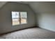 Neutral bedroom with window and carpet floors at 130 Dockside Dr # 380, Fayetteville, GA 30215
