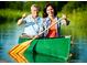 Smiling couple rowing a canoe on the lake at 130 Dockside Dr # 380, Fayetteville, GA 30215