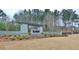 Stone entrance to The Canoe Club community with lush landscaping and well-maintained grounds at 130 Dockside Dr # 380, Fayetteville, GA 30215