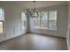 Spacious dining room with wainscoting and large windows that offer scenic wooded views at 130 Dockside Dr # 380, Fayetteville, GA 30215