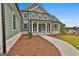 Charming two-story home with a manicured lawn, stone accents, and a covered front porch at 130 Dockside Dr # 380, Fayetteville, GA 30215