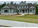 An inviting two-story home boasts meticulous landscaping and charming curb appeal at 130 Dockside Dr # 380, Fayetteville, GA 30215
