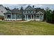 Beautiful two-story home features a manicured lawn, charming curb appeal, and stone accents at 130 Dockside Dr # 380, Fayetteville, GA 30215