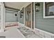 Front porch features a stone walkway, wood and glass front door, and stylish lighting at 130 Dockside Dr # 380, Fayetteville, GA 30215