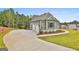 View of the detached two-car garage with a concrete driveway and well-kept lawn at 130 Dockside Dr # 380, Fayetteville, GA 30215