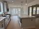 Bright, open kitchen showcases a large island with stone countertops and modern appliances at 130 Dockside Dr # 380, Fayetteville, GA 30215