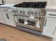 Stainless steel Zline oven and cooktop with light cabinets and modern hardware at 130 Dockside Dr # 380, Fayetteville, GA 30215