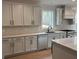 Bright, modern kitchen with stainless steel appliances, marble countertops, and ample cabinet space at 130 Dockside Dr # 380, Fayetteville, GA 30215