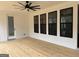 Covered patio with a ceiling fan and multiple windows offering backyard views at 130 Dockside Dr # 380, Fayetteville, GA 30215
