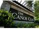 Close-up of The Canoe Club community signage at 130 Dockside Dr # 380, Fayetteville, GA 30215