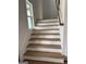 Wooden staircase with white risers and a window at 130 Dockside Dr # 380, Fayetteville, GA 30215