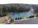 Aerial view of three well-maintained tennis courts surrounded by lush landscaping and convenient parking at 130 Dockside Dr # 380, Fayetteville, GA 30215