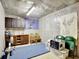 Basement with cabinets, exercise equipment, and ample storage space at 25 Grange Way, Sharpsburg, GA 30277